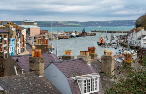 Hilltop view of the Harbour of Weymouth and Weymouth Bay, County of Dorset, United Kingdom Harbour of Weymouth and Weymouth Bay seen from the hill top weymouth dorset stock pictures, royalty-free photos & images