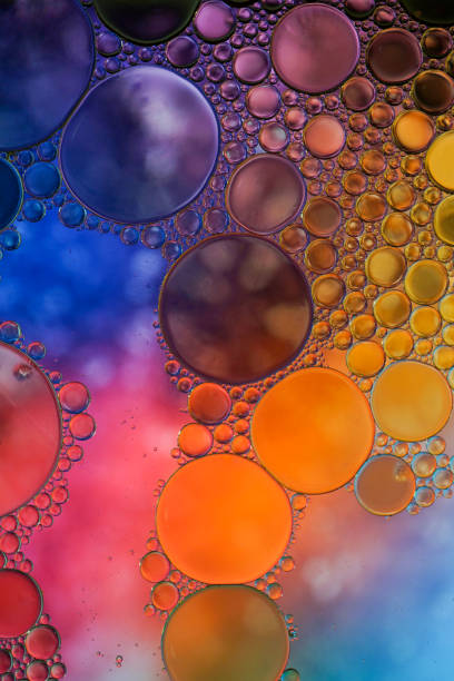istock multi colored oil circles on the water, colorful background 1481865419