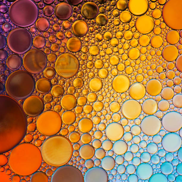 istock multi colored oil circles on the water, colorful background 1481865424