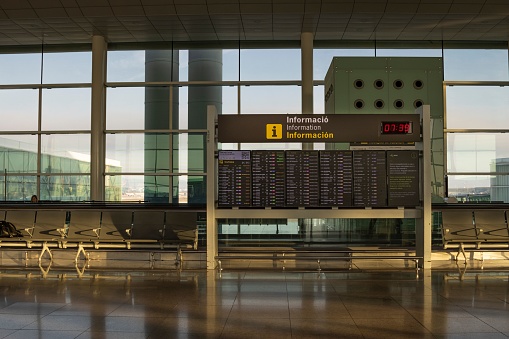 Barcelona, Spain – March 23, 2023: An airport terminal at Josep Tarradellas Barcelona-El Prat Airport, displays the departure and arrival times for various flights