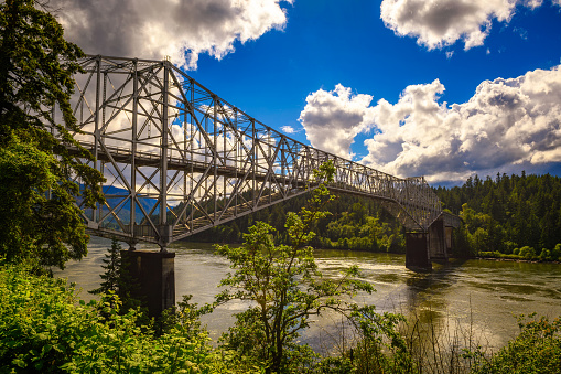 Bridge of the Gods over the Columbia River in Cascade Locks, Oregon. It is a steel truss cantilever bridge connecting Oregon and Washington.