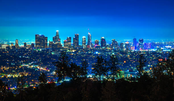 Los Angeles skyline photographed from Griffith Park at night stock photo