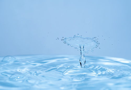 Water drop on blue background.