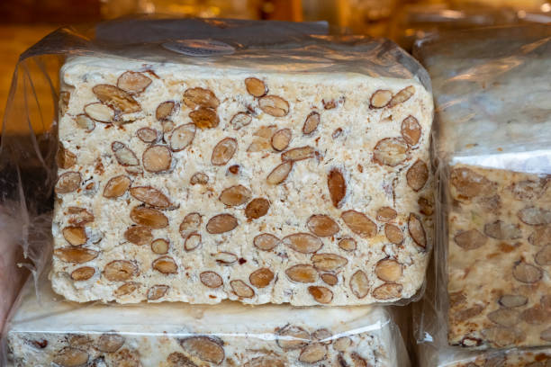 istock Traditional nougat on black plate. Selective focus 1481871246