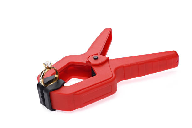 istock The gemstone ring is clamped in a red plastic clamp. 1481871545