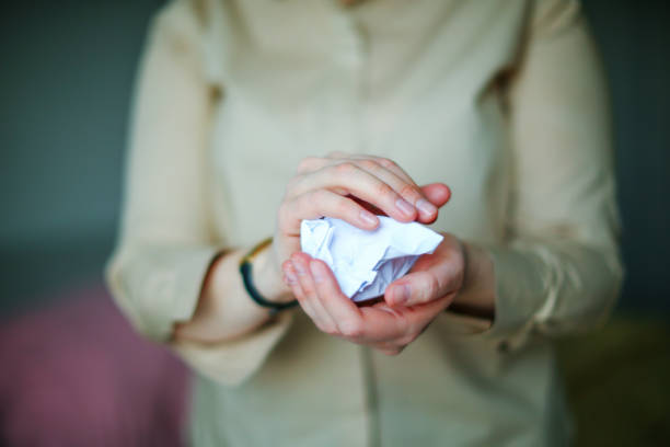 istock woman holds crumpled paper 1481872406