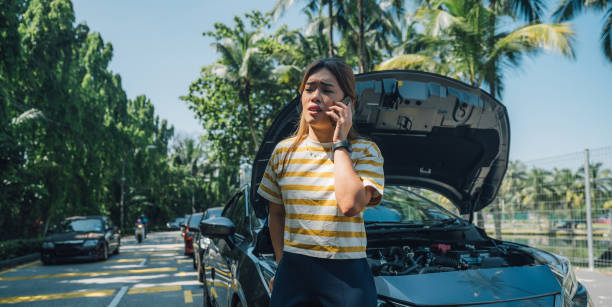 istock Solving Car Troubles with Technology: How a Young Asian Woman Used Her Smartphone to Get Help 1481872867