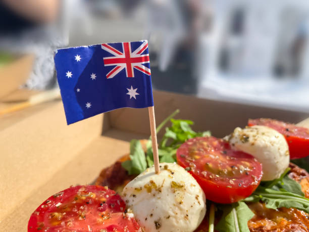 istock Small flags of Australia in the box with pizza, cherry tomatoes and cheese 1481876065