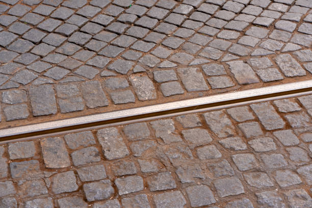 Cobblestone road with tramway rail in Lisbon, Portugal