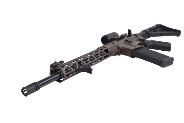 istock AR15 carbine, brown rifle isolated on white background with collimator.Tuned light handguard 1481882146