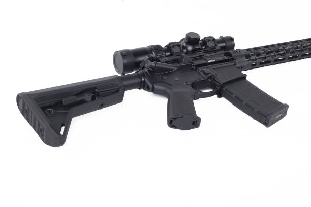 istock AR15 carbine, black rifle isolated on white background with collimator.Tuned light handguard 1481882492