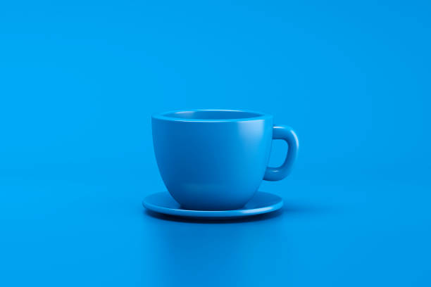 голубая кофейная чашка на синем фоне - coffee cup black coffee isolated стоковые фото и изображения
