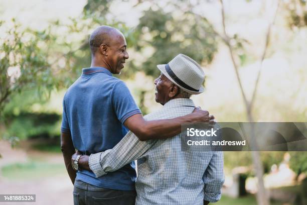 Portrait Of An Elderly Father And Adult Son Stock Photo - Download Image Now - Father, Embracing, Father's Day
