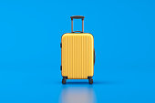 Yellow suitcase on blue background