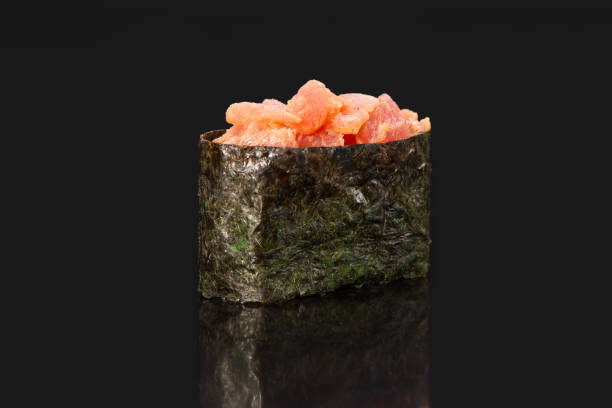 istock hot sushi. meat with mayo sauce, black studio background, menu photography 1481887707
