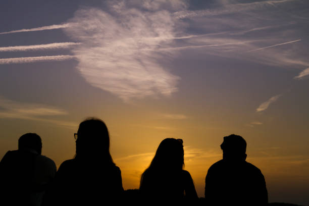 People watching the sunset in a viewpoint of Toledo in Autumn