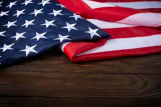 istock US flag on wooden background with copyspace 1481889283
