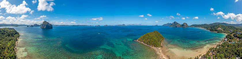 Drone panorama of the paradisiacal Maremegmeg beach near El Nido on the Philippine island of Palawan during the day in sunshine