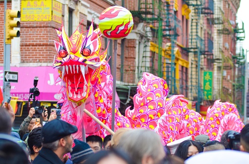 New York, United States – February 12, 2023: A group of people celebrating the 25th Chinese Lunar New Year during a festival in Manhattan-Chinatown