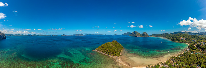 Drone panorama of the paradisiacal Maremegmeg beach near El Nido on the Philippine island of Palawan during the day in sunshine