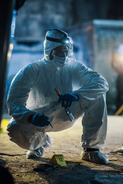 Forensics Specialist Working with Professional Tools and Equipment on Evidence Found on Crime Scene. Expert Gathering Traces of DNA and Fingerprints From a Wallet that Belongs to the Victim of Mugging