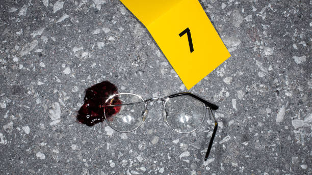 realistic police case file photo: bloody glasses found on crime scene marked as evidence for a suicide case. domestic violence led to a dead victim. example of forensics photography - forensic science flash imagens e fotografias de stock