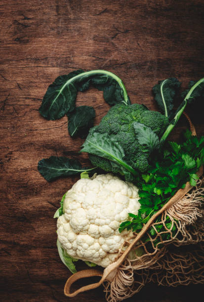 istock Food background with cauliflower and broccoli on old rustic wood kitchen table, top view, copy space 1481903484