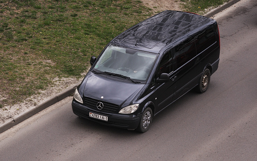 Belarus, Minsk-13.04.2023:Black passenger van Mercedes-Benz W447 Viano in the city street.