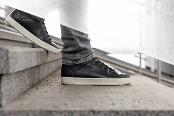 istock close-up shot of a man going down the stairs. 1481911713