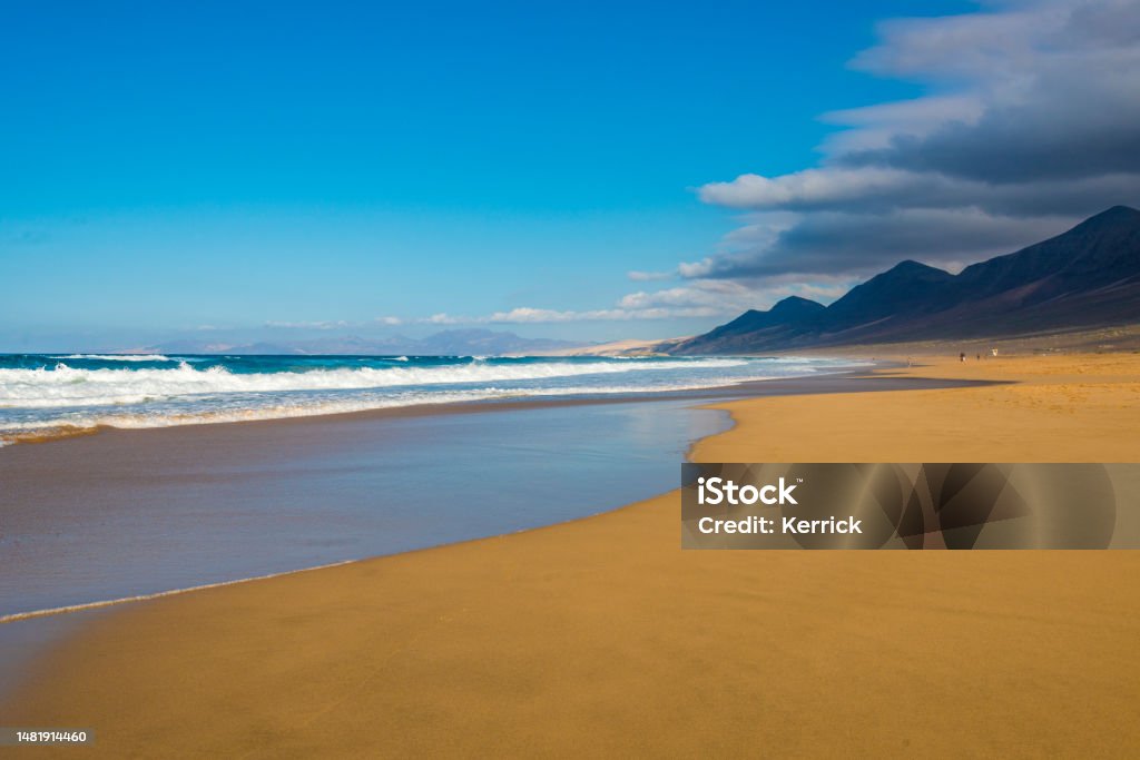 Fuerteventura - beautiful beach and mountains of Cofete in afternoon light 4x4 Stock Photo Fuerteventura - beautiful beach and mountains of Cofete in afternoon light 4x4 Stock Photo