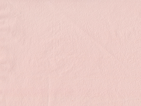Handmade pink paper with paper structure. Meant as background.