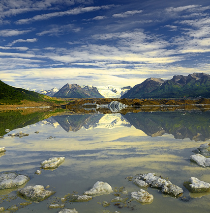 Root Glacier, McCarthy and Old Kennecott copper Mine a destination of tourists seeking access to Wrangell-St. Elias National Park and Preserve, Alaska, USA, UNESCO World Heritage Site. Ice floating in a glacial lake