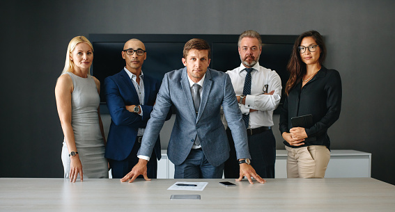 Full length portrait of a group of businesspeople in their office