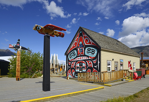The former Skookum Jim House today Parks Canada home and Totem Poles of Carcross. Indigenous Art in a small touristic town. Carcross is home to the Carcross/Tagish First Nation, Yukon, Canada