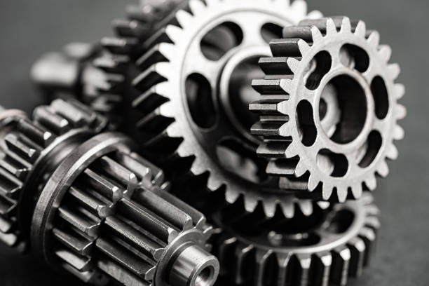 istock Gear and cogs wheels, clock mechanism, brass metal engine industrial. 1481921923