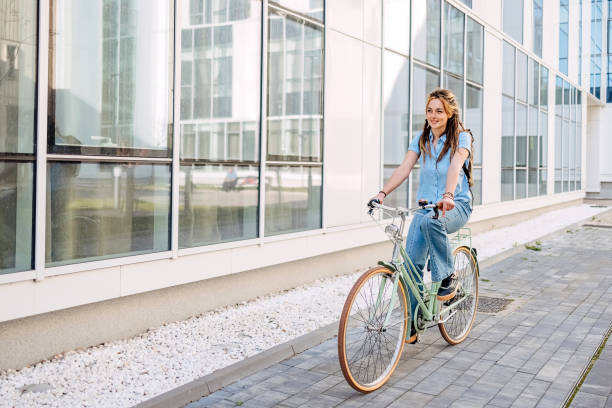 istock Young woman rides a bicycle 1481927372