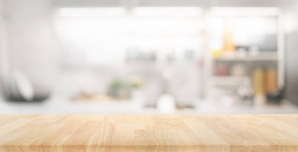 istock Selective focus.Wood table top on blur kitchen counter background.For montage product display or design key visual 1481934178
