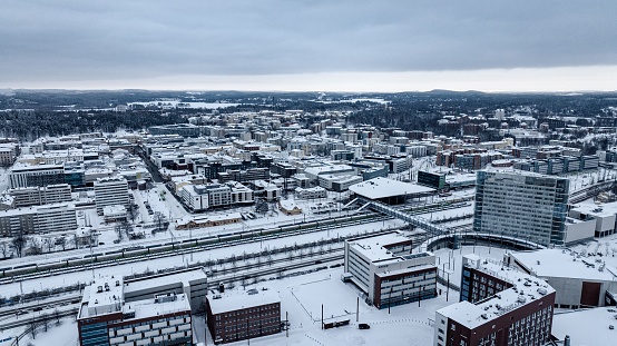 Jyvaskyla, Finland – December 26, 2022: Aerial view of the railway station and cityscape of Jyvaskyla, cloudy, winter evening in Finland