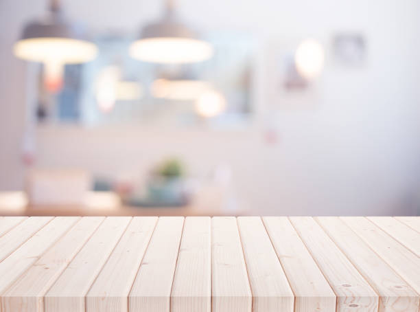 istock elective focus.Wood table top on blur living room or kitchen  background 1481934404