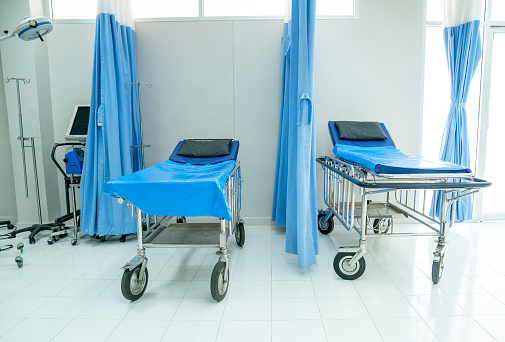 Empty of emergency room with two mobile beds in hospital to support and treatment the patient.