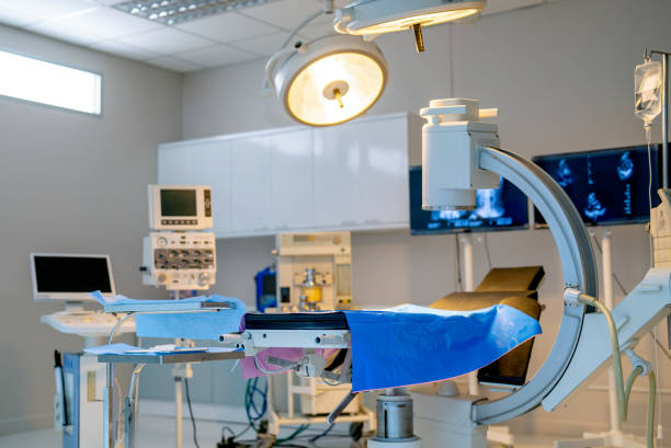 istock Close up empty operation room with no people and view through clear mirror contain light and tools and instrument to support for treatment the patient. 1481938438
