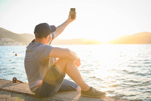 istock mature adult man resting on the beach 1481941842