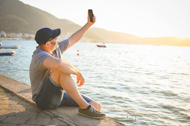 istock mature adult man resting on the beach 1481941848