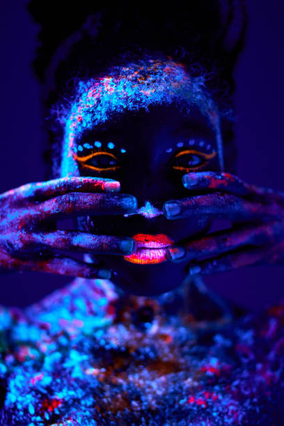 istock young black female with fluorescent prints on face, unusual prints, body art 1481945060