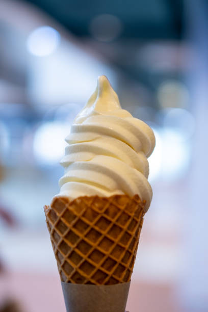 istock Vanilla Ice cream with waffle cone. blur background. 1481945917