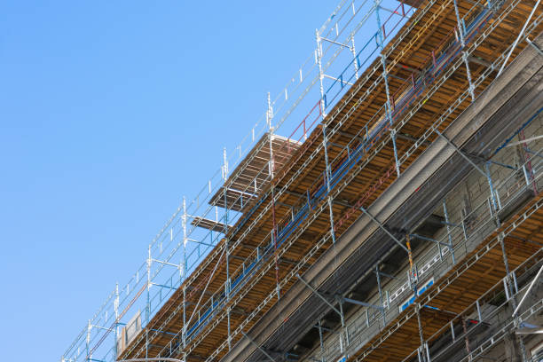 Skyscrapers or multi-storey building in scaffolding poles. Special construction