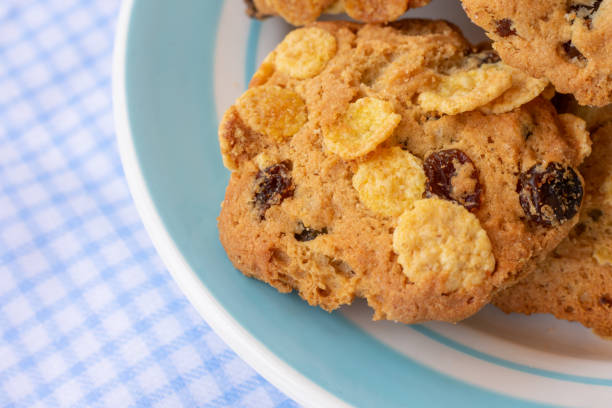 istock Group of cereal cookies in blue plate on table with tablecloth. 1481954232