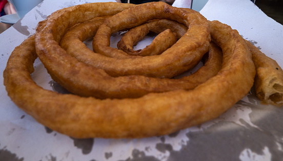 Closeup of typical Spanish Churro sold on the street.