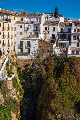 Houses built on the edge of the cliff, in the ancient city of Ronda, Spain.