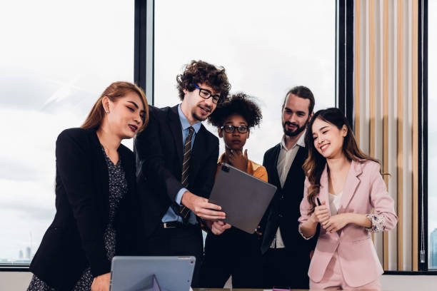istock Diverse colleagues gather in brainstorm discuss statistics together. 1481956157